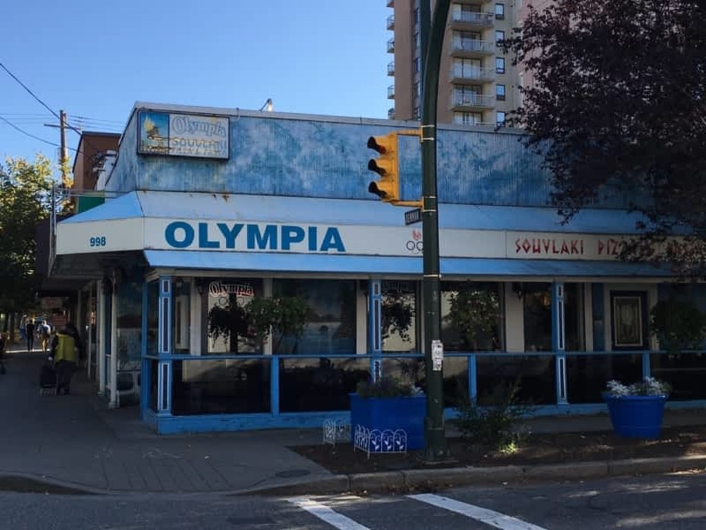 Olympia Pizza storefront at 998 Denman Street — blue awning, OLYMPIA signage, West End Vancouver